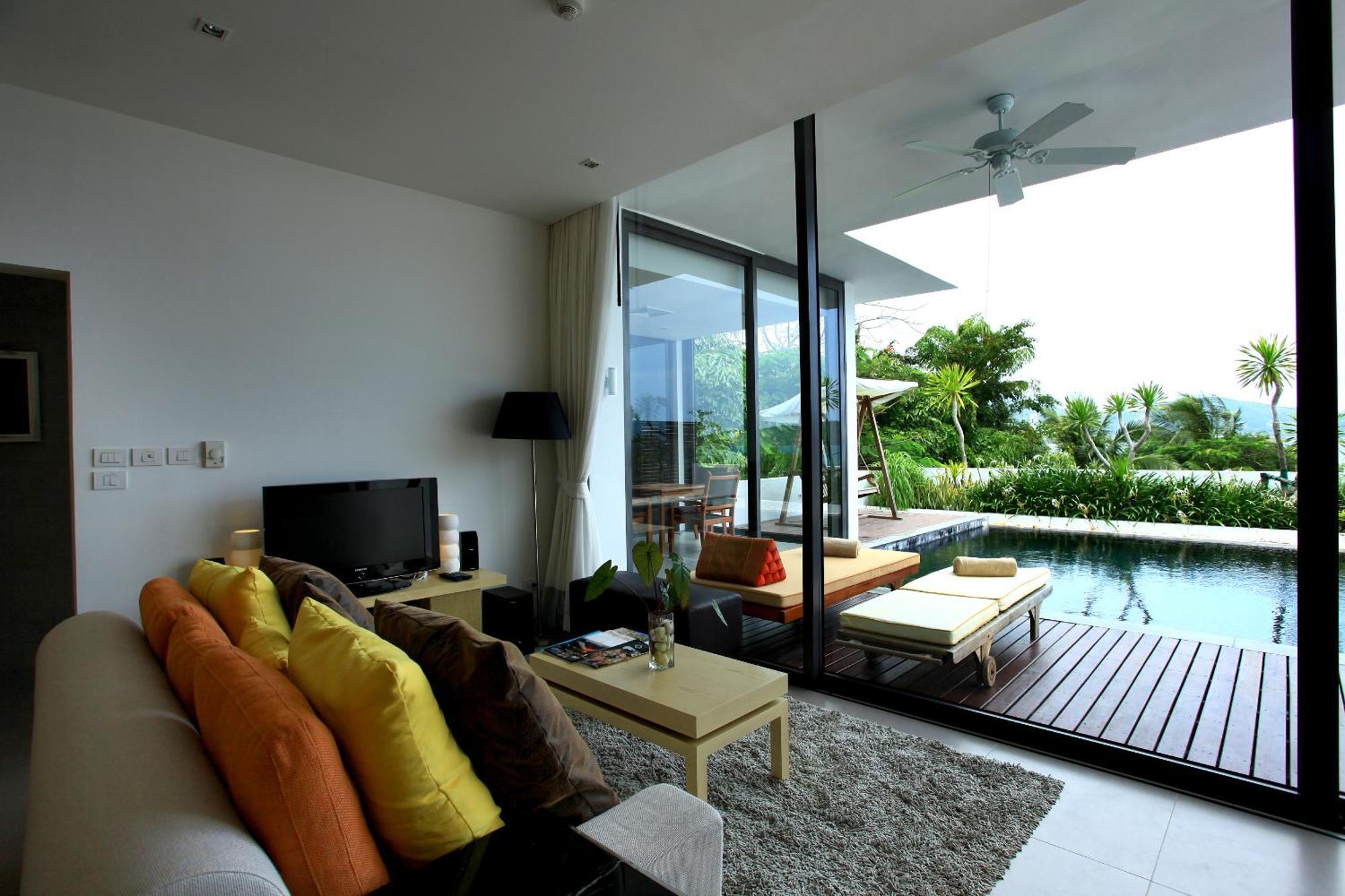 Indochine Resort&Villas - SHA Extra Plus Patong Exterior foto A living room with a view of the pool